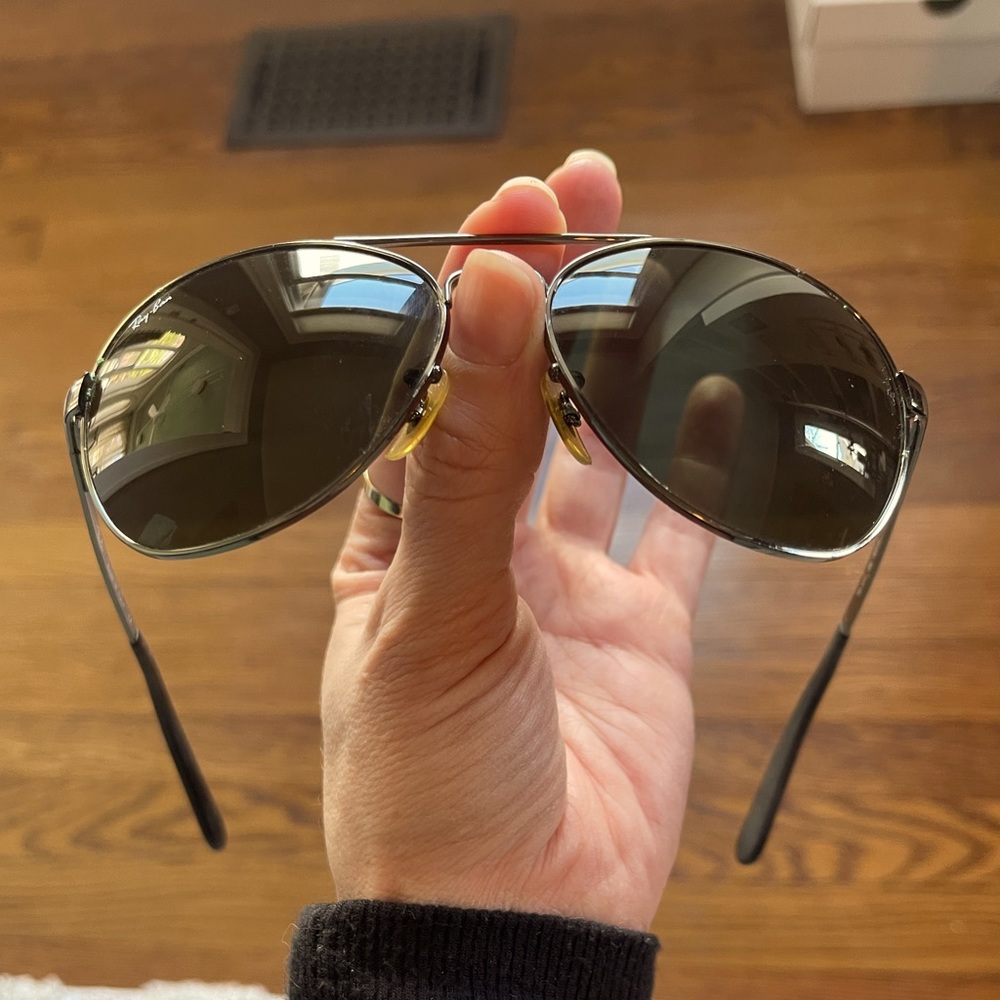 Ray Ban gunmetal gray and black gradient lens aviator sunglasses.